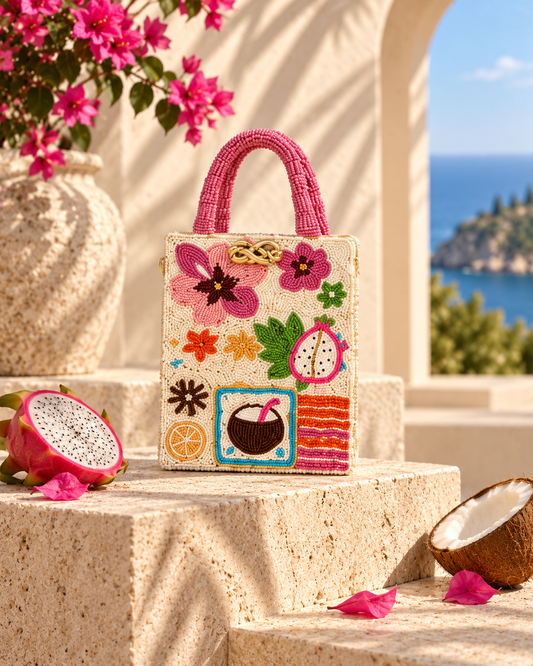 The Pink Tropics Mini Tote - ivory beaded mini tote with tropical fruit and floral motifs
